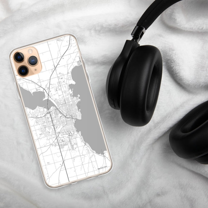 Custom Oshkosh Wisconsin Map Phone Case in Classic on Table with Black Headphones
