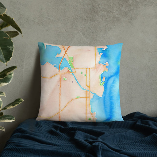 Custom Oshkosh Wisconsin Map Throw Pillow in Watercolor on Bedding Against Wall