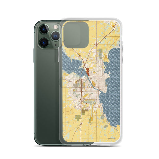 Custom Oshkosh Wisconsin Map Phone Case in Woodblock on Table with Laptop and Plant