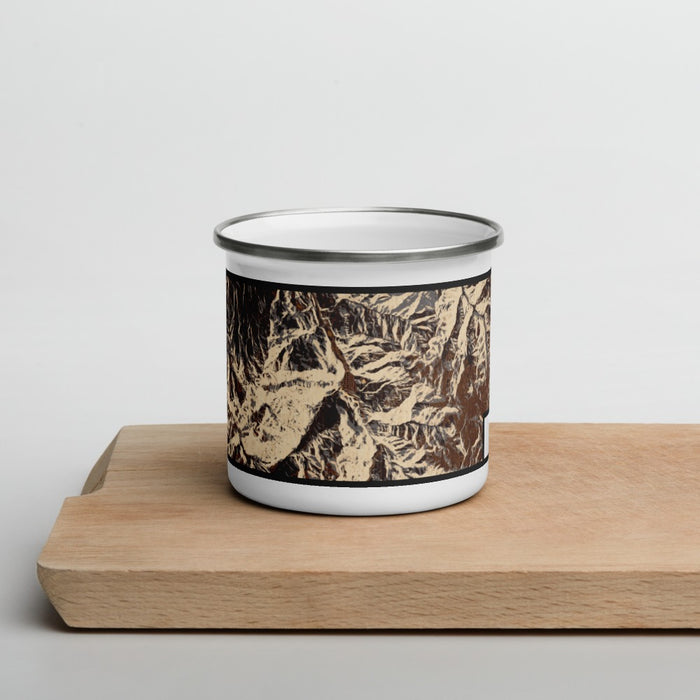 Front View Custom Ouray Colorado Map Enamel Mug in Ember on Cutting Board