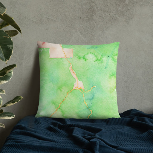 Custom Ouray Colorado Map Throw Pillow in Watercolor on Bedding Against Wall