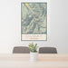 24x36 Ouray Colorado Map Print Portrait Orientation in Woodblock Style Behind 2 Chairs Table and Potted Plant