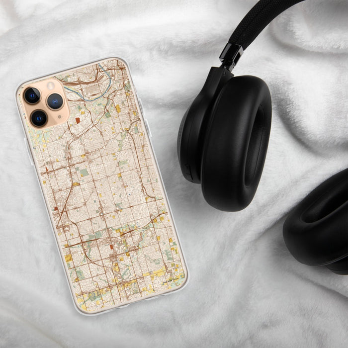 Custom Overland Park Kansas Map Phone Case in Woodblock on Table with Black Headphones