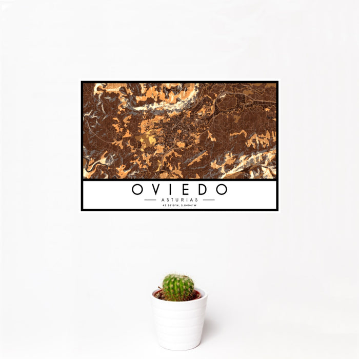 12x18 Oviedo Asturias Map Print Landscape Orientation in Ember Style With Small Cactus Plant in White Planter