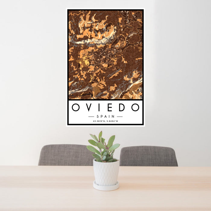 24x36 Oviedo Spain Map Print Portrait Orientation in Ember Style Behind 2 Chairs Table and Potted Plant