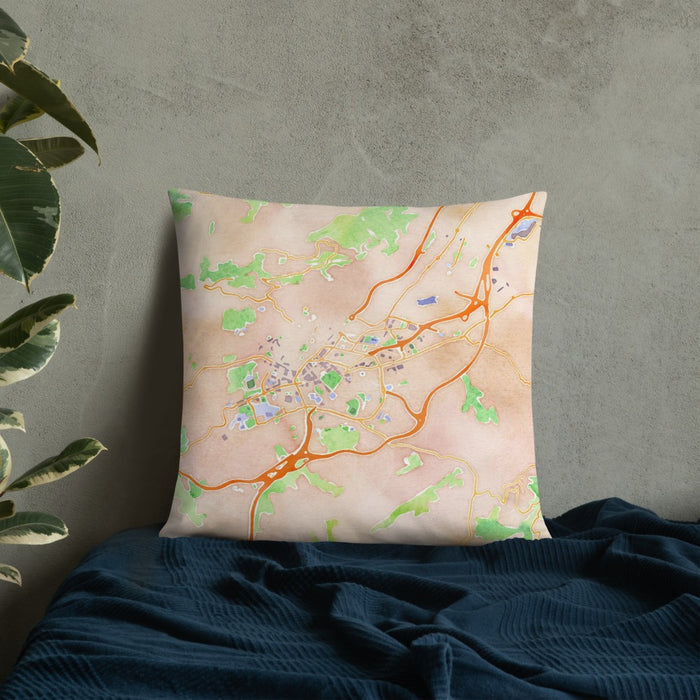 Custom Oviedo Spain Map Throw Pillow in Watercolor on Bedding Against Wall