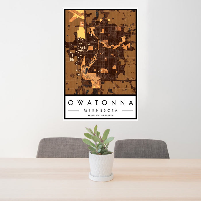 24x36 Owatonna Minnesota Map Print Portrait Orientation in Ember Style Behind 2 Chairs Table and Potted Plant