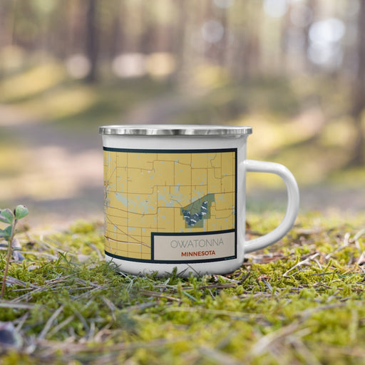 Right View Custom Owatonna Minnesota Map Enamel Mug in Woodblock on Grass With Trees in Background