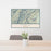 24x36 Oxbow Oregon Map Print Lanscape Orientation in Woodblock Style Behind 2 Chairs Table and Potted Plant