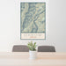 24x36 Oxbow Oregon Map Print Portrait Orientation in Woodblock Style Behind 2 Chairs Table and Potted Plant