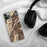Custom Oxbow Oregon Map Phone Case in Ember on Table with Black Headphones