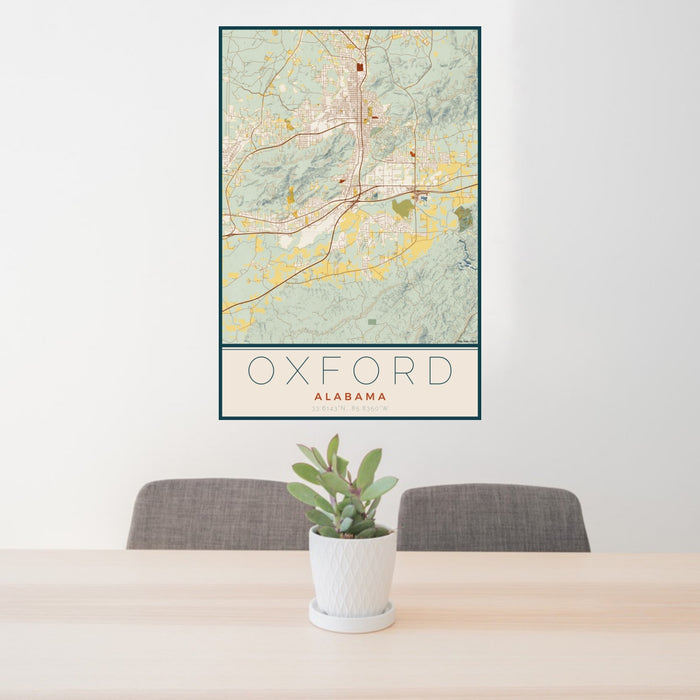 24x36 Oxford Alabama Map Print Portrait Orientation in Woodblock Style Behind 2 Chairs Table and Potted Plant