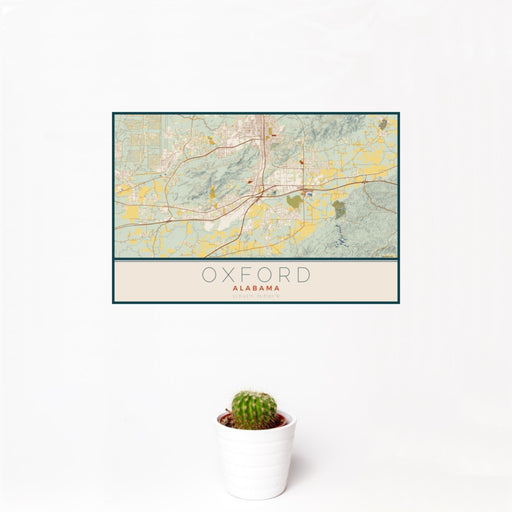 12x18 Oxford Alabama Map Print Landscape Orientation in Woodblock Style With Small Cactus Plant in White Planter