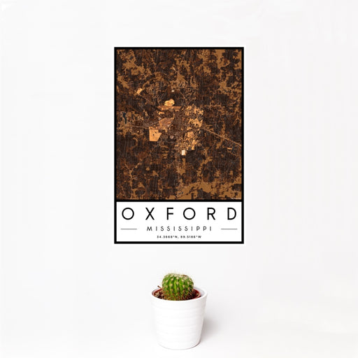 12x18 Oxford Mississippi Map Print Portrait Orientation in Ember Style With Small Cactus Plant in White Planter