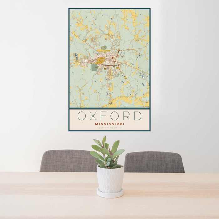 24x36 Oxford Mississippi Map Print Portrait Orientation in Woodblock Style Behind 2 Chairs Table and Potted Plant