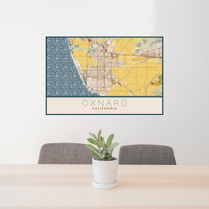 24x36 Oxnard California Map Print Landscape Orientation in Woodblock Style Behind 2 Chairs Table and Potted Plant