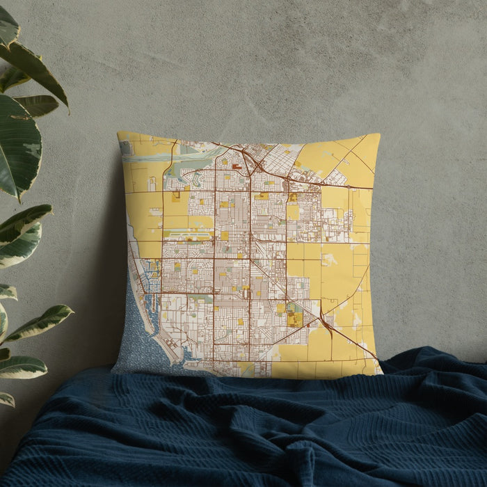 Custom Oxnard California Map Throw Pillow in Woodblock on Bedding Against Wall