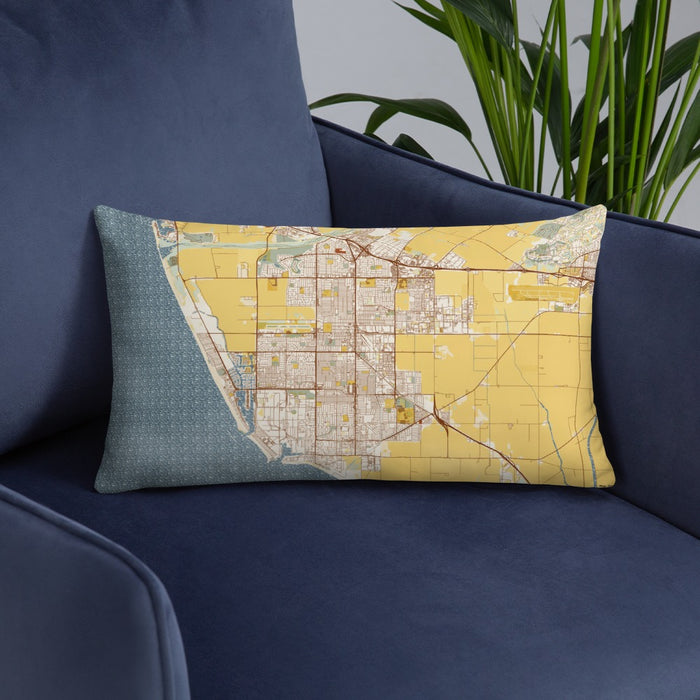 Custom Oxnard California Map Throw Pillow in Woodblock on Blue Colored Chair