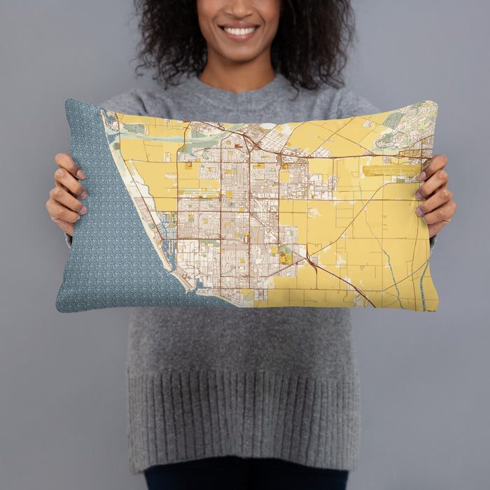 Person holding 20x12 Custom Oxnard California Map Throw Pillow in Woodblock
