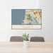 24x36 Pacifica California Map Print Lanscape Orientation in Woodblock Style Behind 2 Chairs Table and Potted Plant