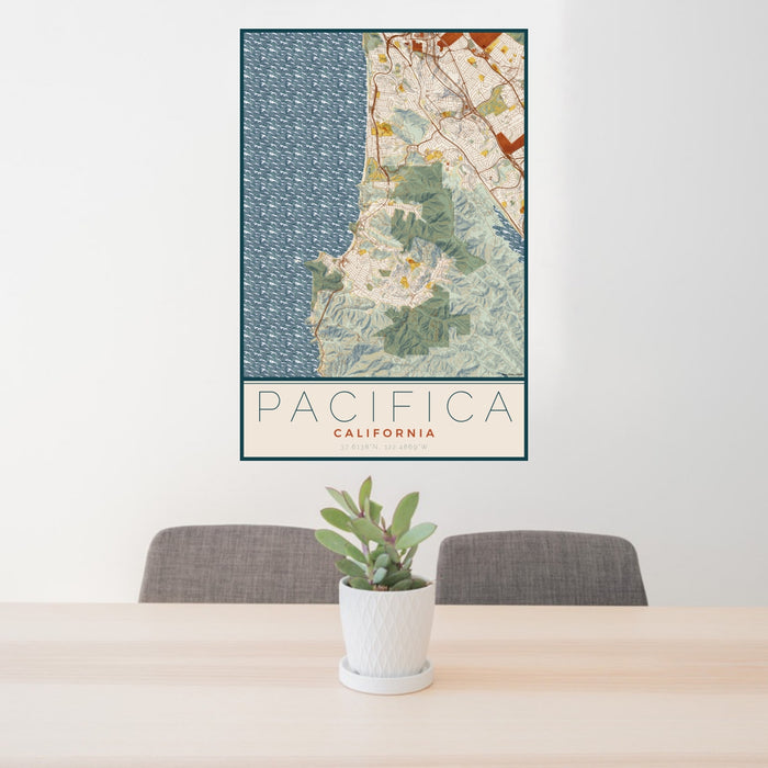 24x36 Pacifica California Map Print Portrait Orientation in Woodblock Style Behind 2 Chairs Table and Potted Plant