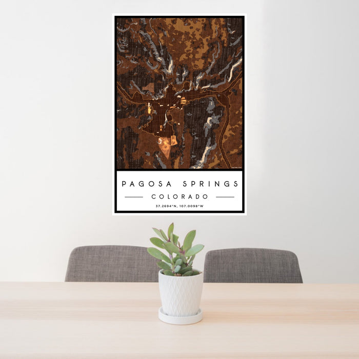24x36 Pagosa Springs Colorado Map Print Portrait Orientation in Ember Style Behind 2 Chairs Table and Potted Plant