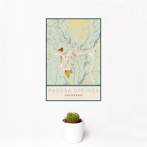 12x18 Pagosa Springs Colorado Map Print Portrait Orientation in Woodblock Style With Small Cactus Plant in White Planter