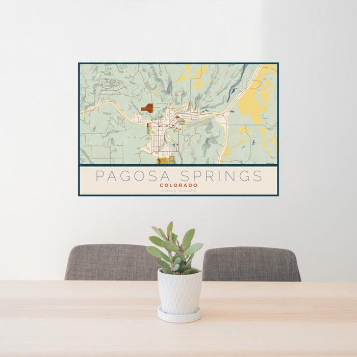 24x36 Pagosa Springs Colorado Map Print Landscape Orientation in Woodblock Style Behind 2 Chairs Table and Potted Plant