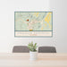 24x36 Pagosa Springs Colorado Map Print Landscape Orientation in Woodblock Style Behind 2 Chairs Table and Potted Plant