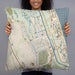 Person holding 22x22 Custom Palm Coast Florida Map Throw Pillow in Woodblock