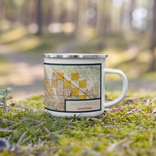 Right View Custom Palm Springs California Map Enamel Mug in Woodblock on Grass With Trees in Background