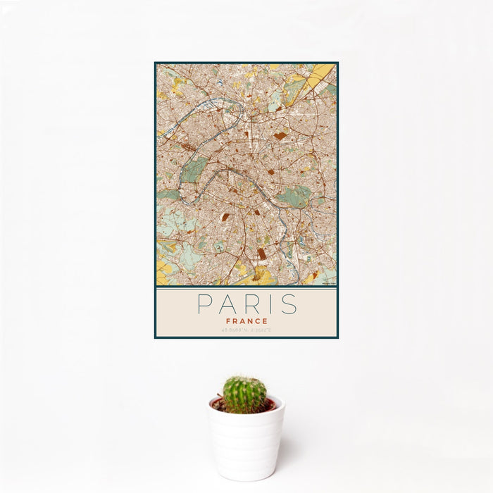 12x18 Paris France Map Print Portrait Orientation in Woodblock Style With Small Cactus Plant in White Planter