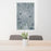 24x36 Paris France Map Print Portrait Orientation in Afternoon Style Behind 2 Chairs Table and Potted Plant