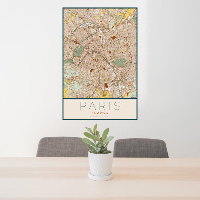24x36 Paris France Map Print Portrait Orientation in Woodblock Style Behind 2 Chairs Table and Potted Plant