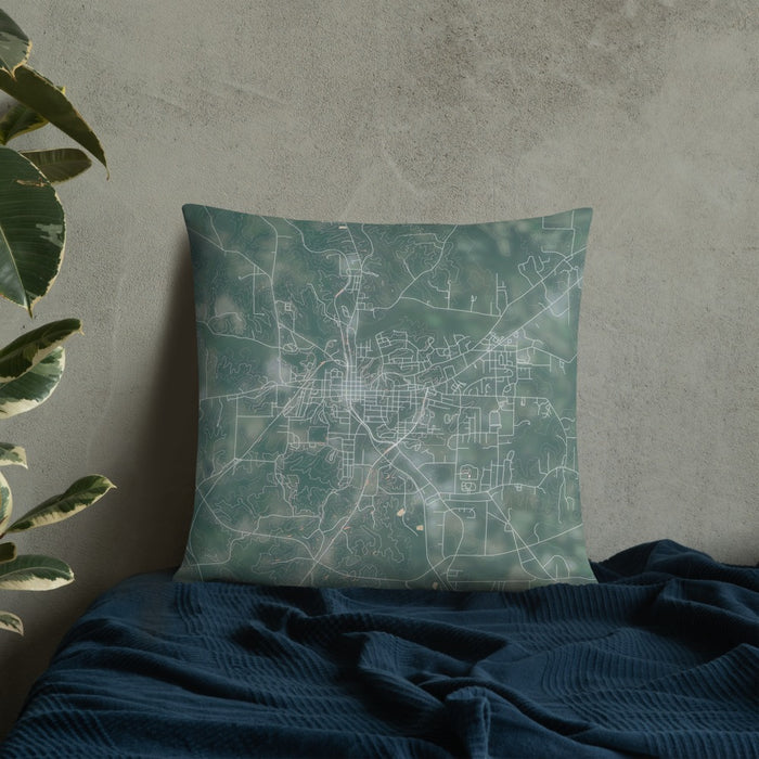 Custom Paris Tennessee Map Throw Pillow in Afternoon on Bedding Against Wall