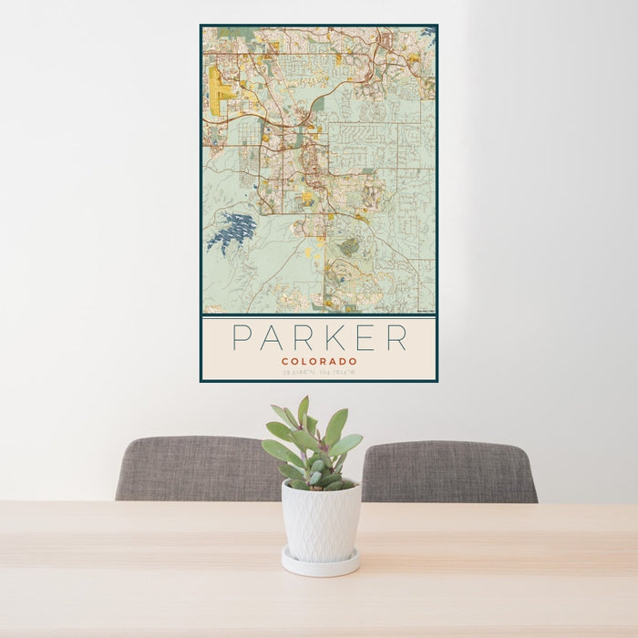 24x36 Parker Colorado Map Print Portrait Orientation in Woodblock Style Behind 2 Chairs Table and Potted Plant