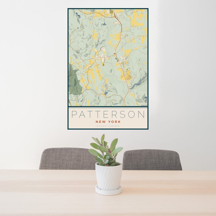 24x36 Patterson New York Map Print Portrait Orientation in Woodblock Style Behind 2 Chairs Table and Potted Plant
