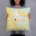 Person holding 18x18 Custom Pawnee City Nebraska Map Throw Pillow in Woodblock
