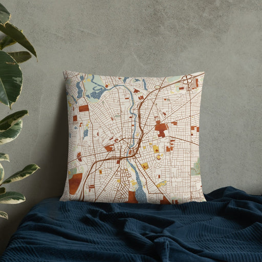 Custom Pawtucket Rhode Island Map Throw Pillow in Woodblock on Bedding Against Wall