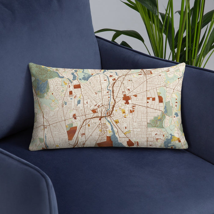 Custom Pawtucket Rhode Island Map Throw Pillow in Woodblock on Blue Colored Chair