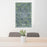 24x36 Pella Iowa Map Print Portrait Orientation in Afternoon Style Behind 2 Chairs Table and Potted Plant