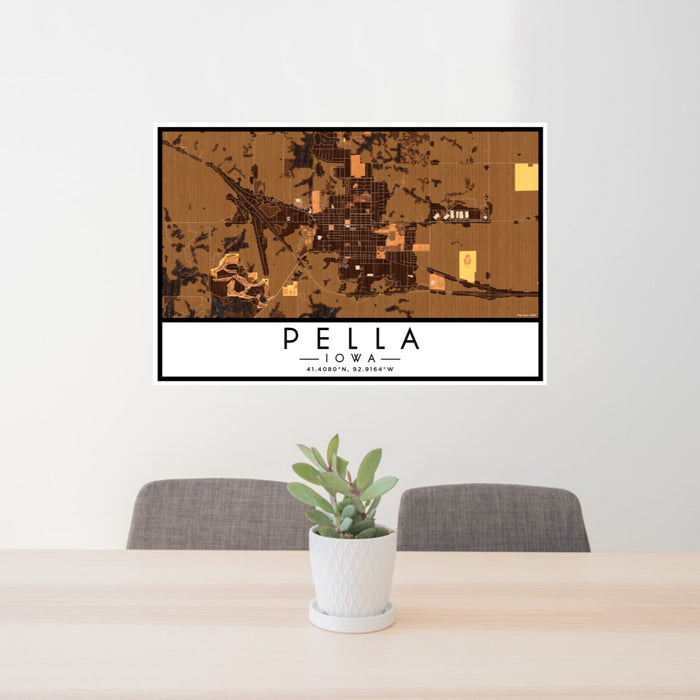 24x36 Pella Iowa Map Print Lanscape Orientation in Ember Style Behind 2 Chairs Table and Potted Plant