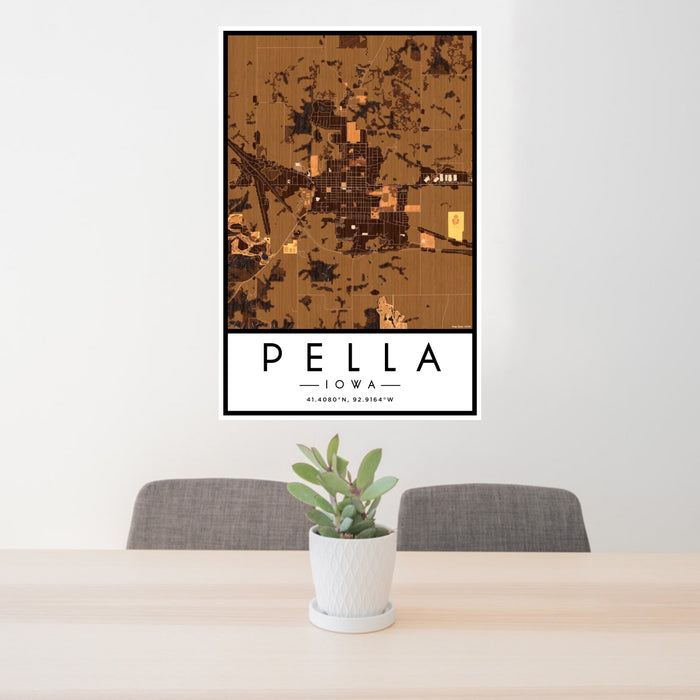 24x36 Pella Iowa Map Print Portrait Orientation in Ember Style Behind 2 Chairs Table and Potted Plant