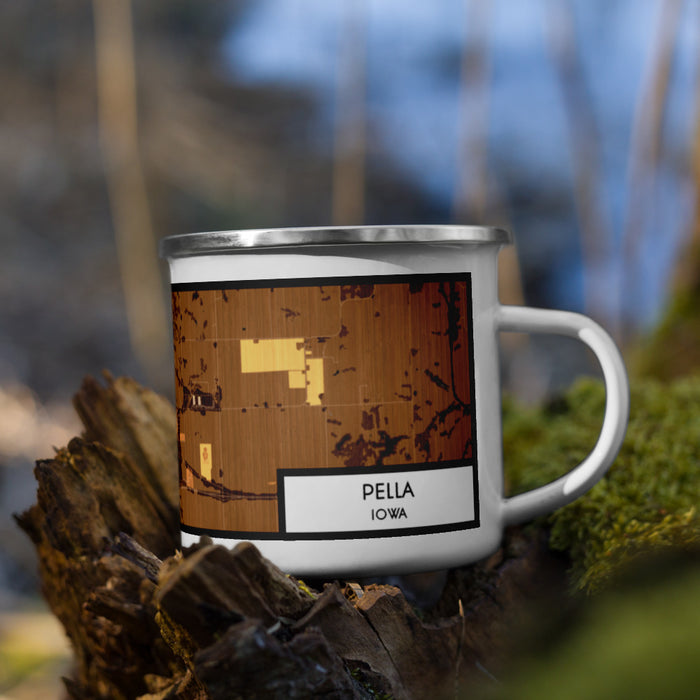 Right View Custom Pella Iowa Map Enamel Mug in Ember on Grass With Trees in Background
