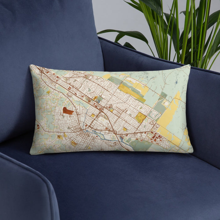 Custom Petaluma California Map Throw Pillow in Woodblock on Blue Colored Chair