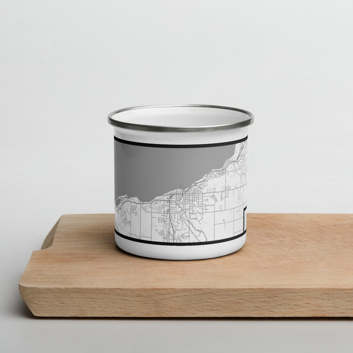 Front View Custom Petoskey Michigan Map Enamel Mug in Classic on Cutting Board