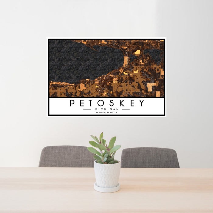 24x36 Petoskey Michigan Map Print Landscape Orientation in Ember Style Behind 2 Chairs Table and Potted Plant