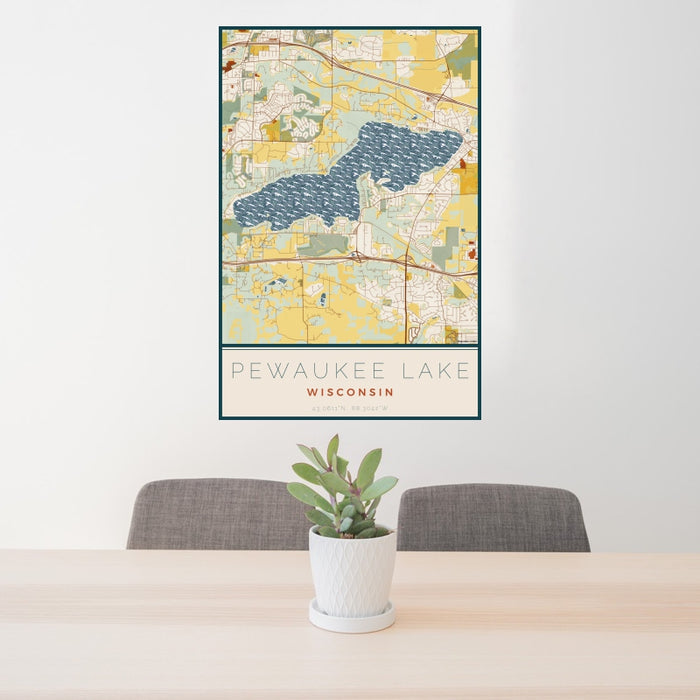 24x36 Pewaukee Lake Wisconsin Map Print Portrait Orientation in Woodblock Style Behind 2 Chairs Table and Potted Plant