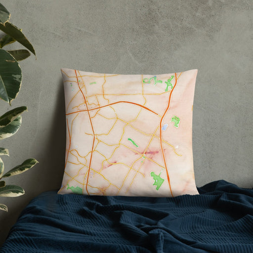 Custom Pflugerville Texas Map Throw Pillow in Watercolor on Bedding Against Wall