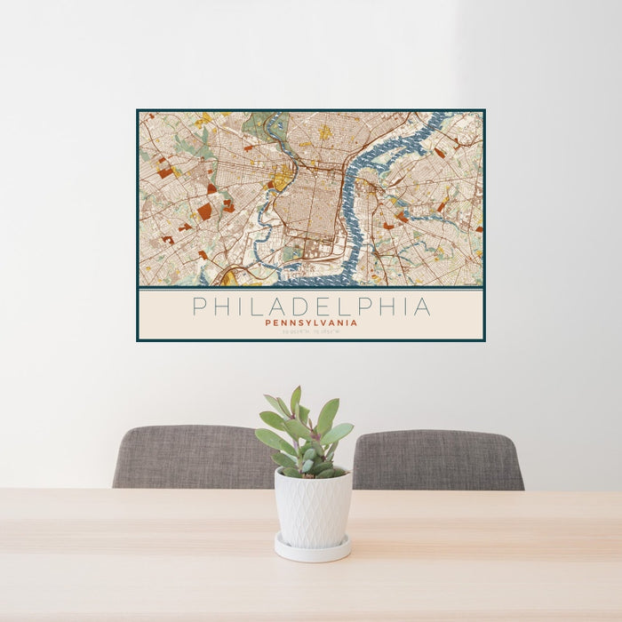 24x36 Philadelphia Pennsylvania Map Print Landscape Orientation in Woodblock Style Behind 2 Chairs Table and Potted Plant